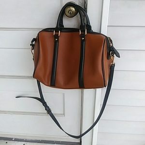 A cross body Urban Expressions Faux Leather bag